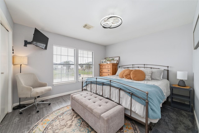 610 Seashell Dr, Freeport, TX 77541 - bedroom featuring baseboards and wood finished floors