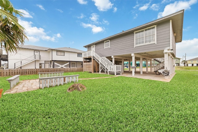 610 Seashell Dr, Freeport, TX 77541 - rear view of property featuring stairway, a patio, and a carport