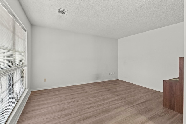 14115 Lantern Ln, Houston, TX 77015 - unfurnished room featuring a textured ceiling and light wood finished floors