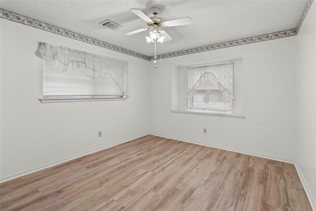 14115 Lantern Ln, Houston, TX 77015 - spare room with a textured ceiling, light wood-type flooring, and ceiling fan