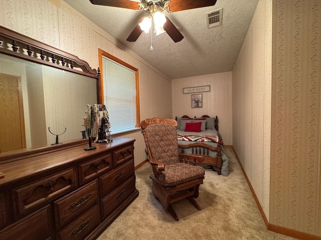 147 County Road 4772, Warren, TX 77664 - bedroom with a textured ceiling, light carpet, ceiling fan, and wallpapered walls