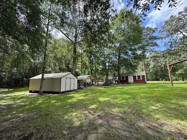 147 County Road 4772, Warren, TX 77664 - view of green lawn featuring a shed
