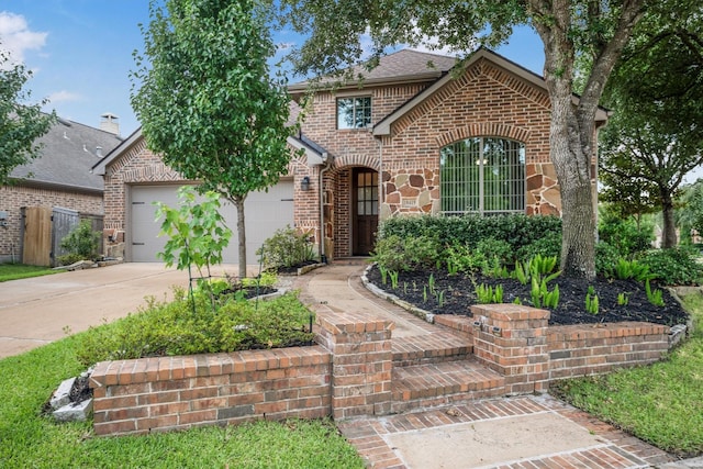 18419 W Willow Oak Bend Dr, Cypress, TX 77433 - view of front of property with brick siding, driveway, and an attached garage