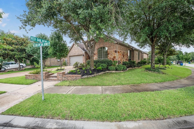 18419 W Willow Oak Bend Dr, Cypress, TX 77433 - view of front of property with a front lawn, brick siding, a garage, driveway, and stone siding