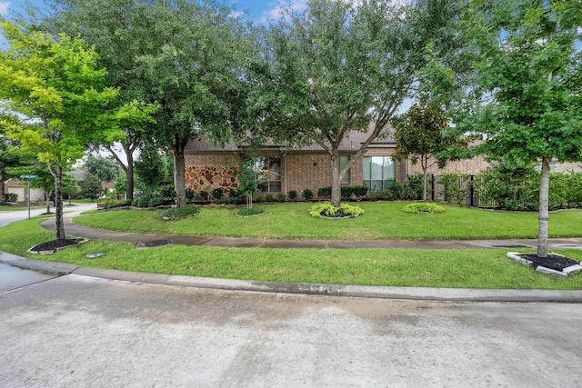 18419 W Willow Oak Bend Dr, Cypress, TX 77433 - view of front of home featuring brick siding and a front yard
