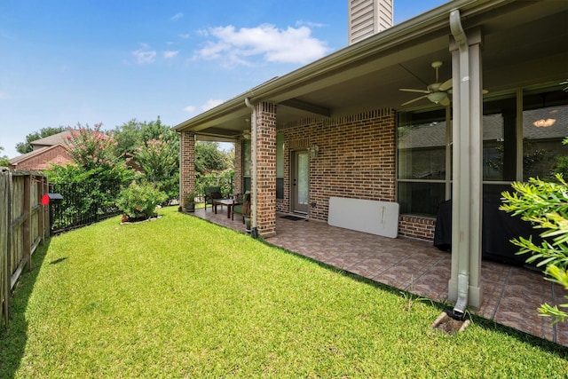 18419 W Willow Oak Bend Dr, Cypress, TX 77433 - fenced backyard with ceiling fan and a patio area