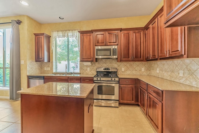 18419 W Willow Oak Bend Dr, Cypress, TX 77433 - kitchen with appliances with stainless steel finishes, light tile patterned floors, light stone countertops, and recessed lighting
