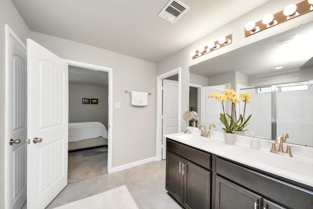 29530 Patricias Way, Katy, TX 77494 - ensuite bathroom featuring double vanity, a stall shower, and tile patterned floors