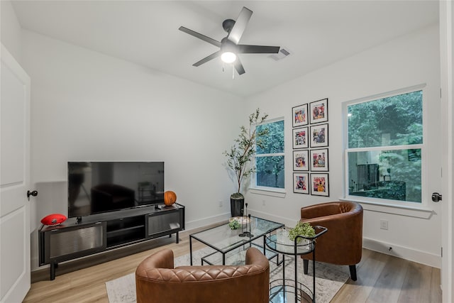 1911 Dewalt St, Houston, TX 77088 - living area with wood finished floors, healthy amount of natural light, and ceiling fan