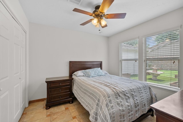 706 Geronimo Ct, Katy, TX 77450 - bedroom with a closet, ceiling fan, and light stone finish floors