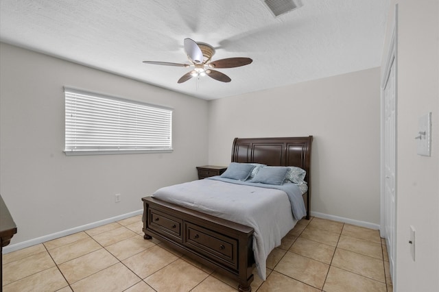706 Geronimo Ct, Katy, TX 77450 - bedroom featuring light tile patterned flooring and a ceiling fan