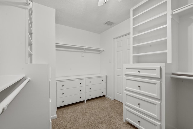 706 Geronimo Ct, Katy, TX 77450 - walk in closet featuring light colored carpet and a ceiling fan