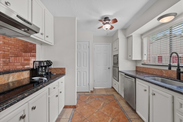 706 Geronimo Ct, Katy, TX 77450 - kitchen featuring stainless steel appliances, exhaust hood, white cabinets, and a ceiling fan