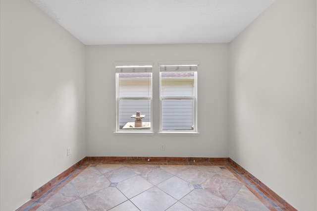 706 Geronimo Ct, Katy, TX 77450 - spare room with baseboards