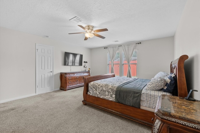 706 Geronimo Ct, Katy, TX 77450 - bedroom featuring light colored carpet, a ceiling fan, and a textured ceiling