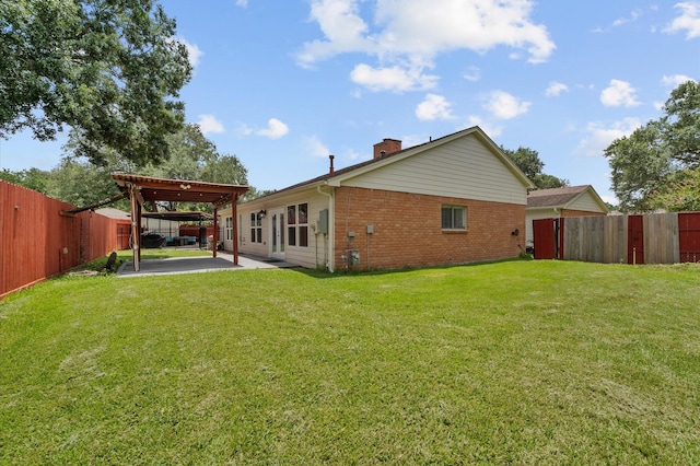 706 Geronimo Ct, Katy, TX 77450 - rear view of property featuring brick siding, a patio area, a chimney, and a fenced backyard