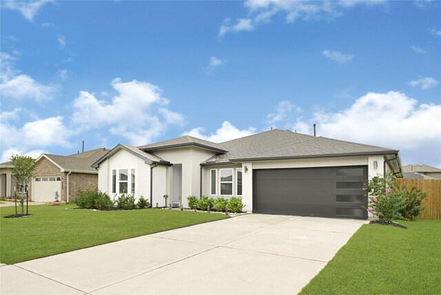 3430 Harper Meadow Ln, Missouri City, TX 77459 - view of front facade featuring driveway, a garage, and stucco siding