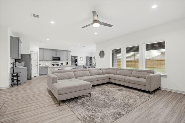 3430 Harper Meadow Ln, Missouri City, TX 77459 - living room featuring light wood-type flooring, ceiling fan, and recessed lighting