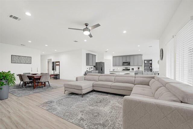 3430 Harper Meadow Ln, Missouri City, TX 77459 - living room featuring light wood-style flooring, recessed lighting, and a ceiling fan