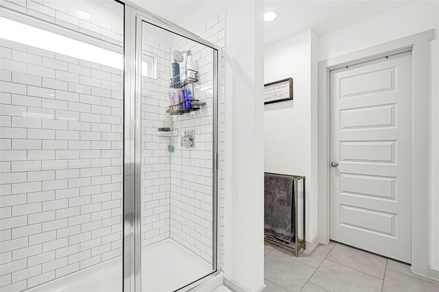 3430 Harper Meadow Ln, Missouri City, TX 77459 - bathroom featuring a stall shower, tile patterned flooring, and recessed lighting