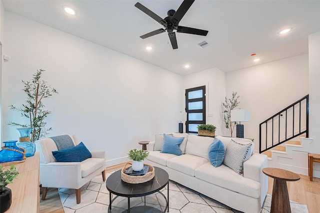 2710 Bostic St, Houston, TX 77093 - living area with light wood-type flooring, a ceiling fan, stairs, and recessed lighting