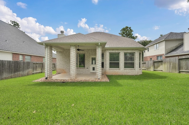 13310 Hidden Valley Dr, Montgomery, TX 77356 - back of house featuring ceiling fan, a patio area, brick siding, a chimney, and a fenced backyard