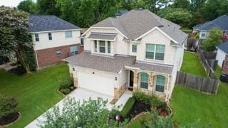 13310 Hidden Valley Dr, Montgomery, TX 77356 - view of front of home featuring concrete driveway and an attached garage