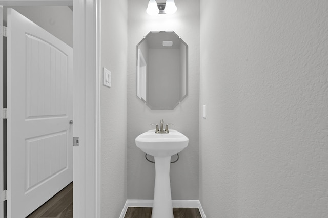 13310 Hidden Valley Dr, Montgomery, TX 77356 - bathroom with wood finished floors and a textured wall