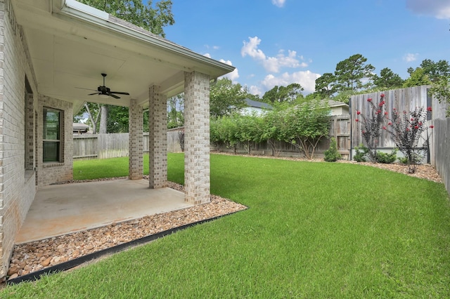 13310 Hidden Valley Dr, Montgomery, TX 77356 - fenced backyard featuring ceiling fan and a patio