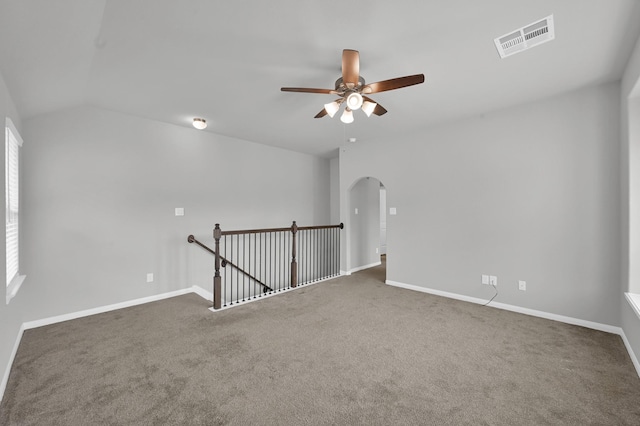 13310 Hidden Valley Dr, Montgomery, TX 77356 - spare room featuring arched walkways, ceiling fan, carpet, and lofted ceiling