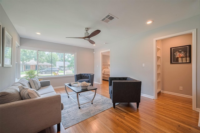 5123 Saxon Dr, Houston, TX 77092 - living area featuring light wood finished floors, ceiling fan, and recessed lighting