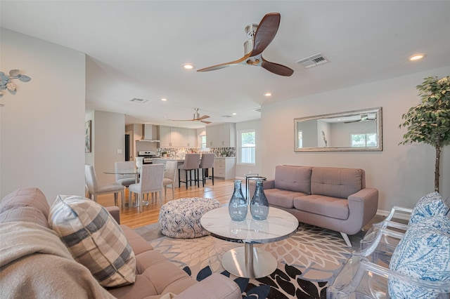 5123 Saxon Dr, Houston, TX 77092 - living area with light wood-style flooring, ceiling fan, and recessed lighting