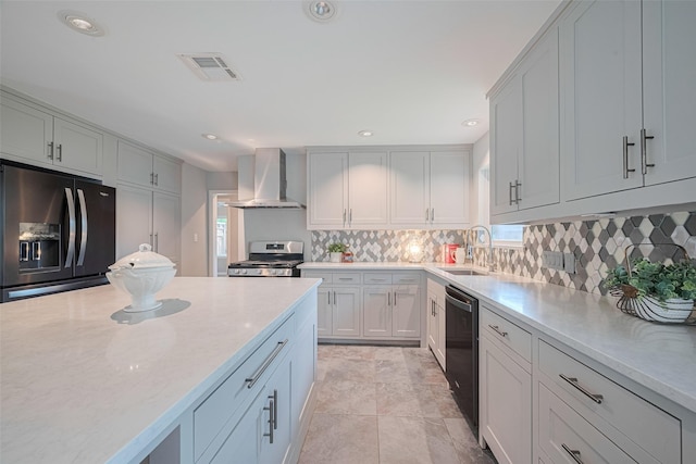 5123 Saxon Dr, Houston, TX 77092 - kitchen with extractor fan, refrigerator with ice dispenser, stainless steel range, dishwashing machine, and plenty of natural light