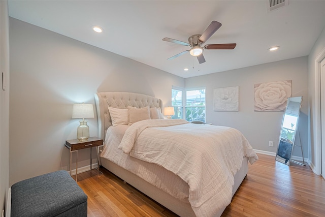 5123 Saxon Dr, Houston, TX 77092 - bedroom with multiple windows, light wood-style flooring, a ceiling fan, and recessed lighting