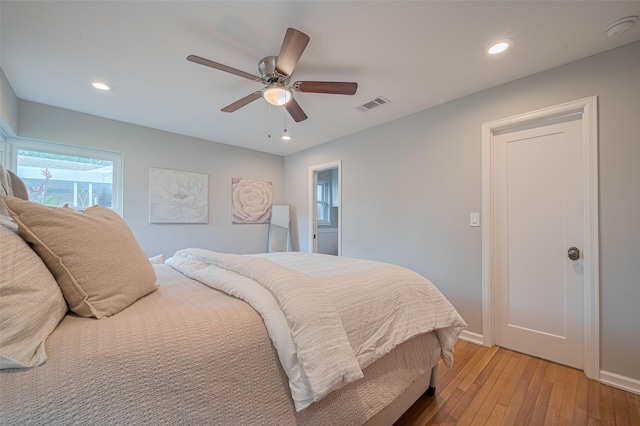 5123 Saxon Dr, Houston, TX 77092 - bedroom with light wood-style flooring, ceiling fan, and recessed lighting