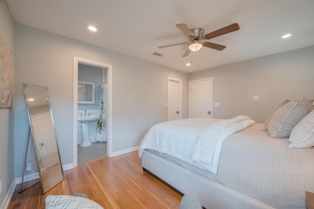 5123 Saxon Dr, Houston, TX 77092 - bedroom with light wood finished floors, recessed lighting, a ceiling fan, and connected bathroom