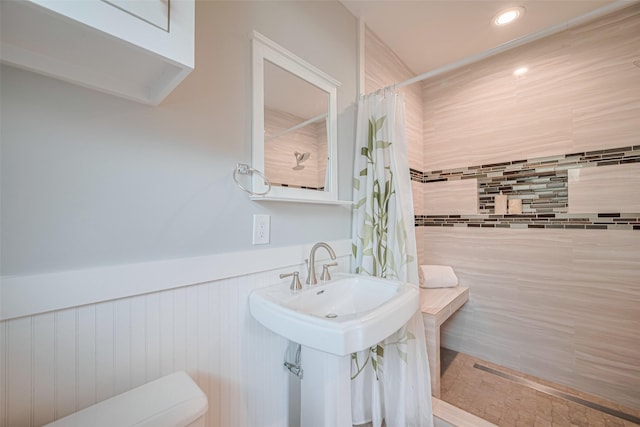 5123 Saxon Dr, Houston, TX 77092 - full bath with a wainscoted wall, tiled shower, and recessed lighting