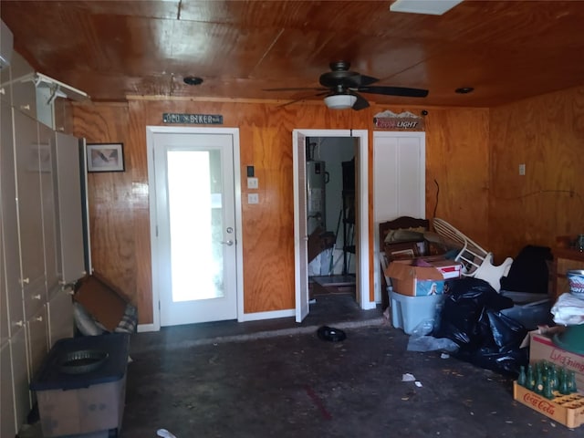 18602 Lippizaner Dr, Cypress, TX 77433 - miscellaneous room featuring wood walls, concrete flooring, and ceiling fan