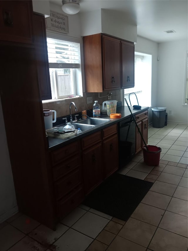 18602 Lippizaner Dr, Cypress, TX 77433 - kitchen featuring black dishwasher, dark countertops, plenty of natural light, and backsplash