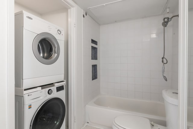 3025 Walnut Bend Ln Unit 37, Houston, TX 77042 - full bathroom featuring stacked washing machine and dryer and  shower combination