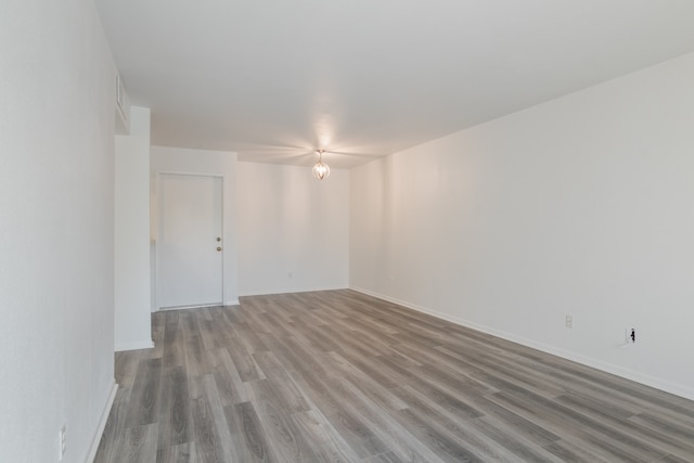 3025 Walnut Bend Ln Unit 37, Houston, TX 77042 - empty room featuring wood finished floors and baseboards