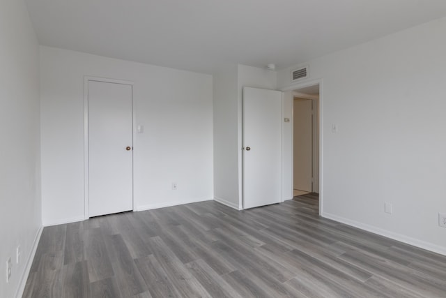 3025 Walnut Bend Ln Unit 37, Houston, TX 77042 - unfurnished room with wood finished floors and baseboards