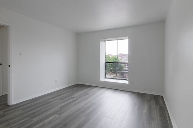 3025 Walnut Bend Ln Unit 37, Houston, TX 77042 - empty room with dark wood-style floors and baseboards
