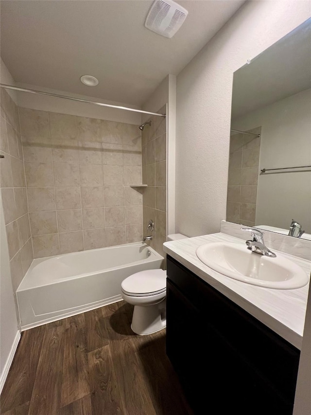 21540 Rustic Elm Dr, New Caney, TX 77357 - full bath with vanity, wood finished floors, and washtub / shower combination