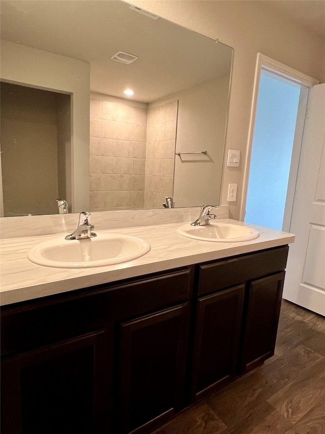 21540 Rustic Elm Dr, New Caney, TX 77357 - bathroom with double vanity and wood finished floors