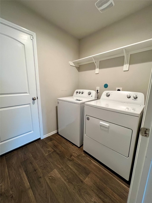21540 Rustic Elm Dr, New Caney, TX 77357 - laundry area with washer and dryer and dark wood-style floors