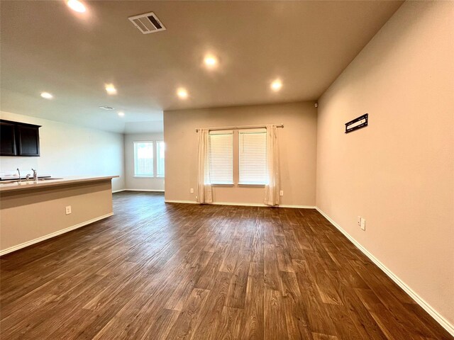 21540 Rustic Elm Dr, New Caney, TX 77357 - unfurnished living room featuring dark wood finished floors and recessed lighting