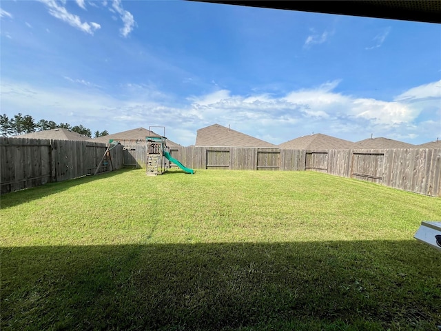 21540 Rustic Elm Dr, New Caney, TX 77357 - fenced backyard featuring a playground