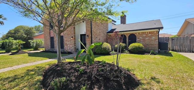47 W Dansby Dr, Galveston, TX 77551 - view of front of home featuring brick siding and a chimney