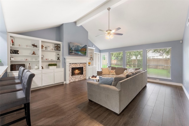 14619 Townsend Ct, Cypress, TX 77429 - living room featuring ceiling fan, a warm lit fireplace, dark wood finished floors, beam ceiling, and high vaulted ceiling